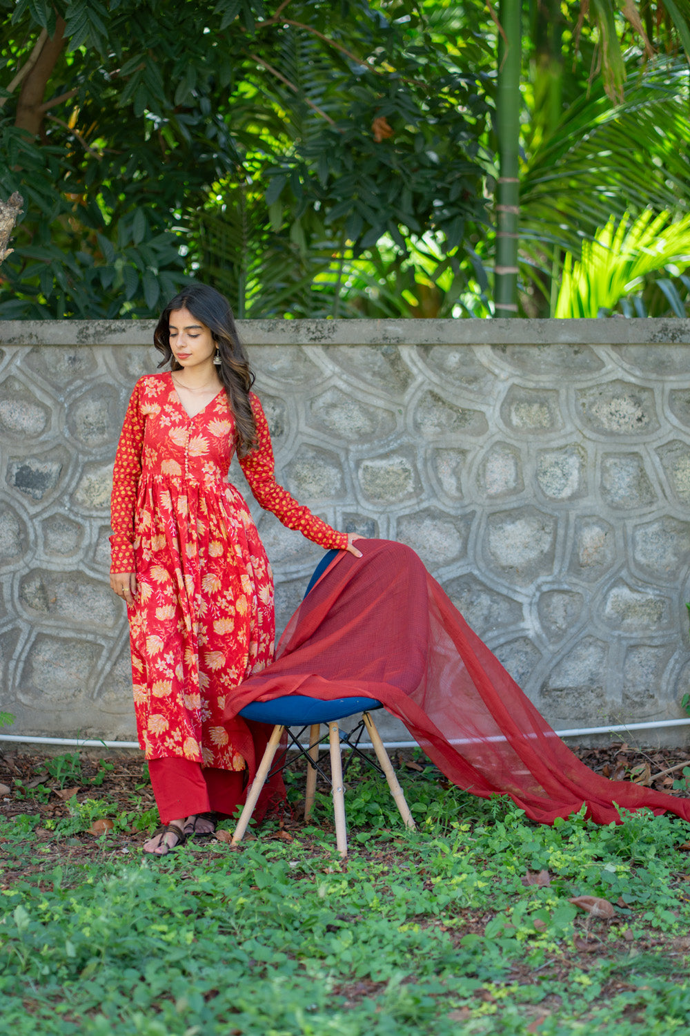 Ishaani red floral anarkali suit set - full length garden view