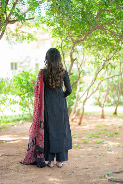 Shruti black suit set - back view with red dupatta