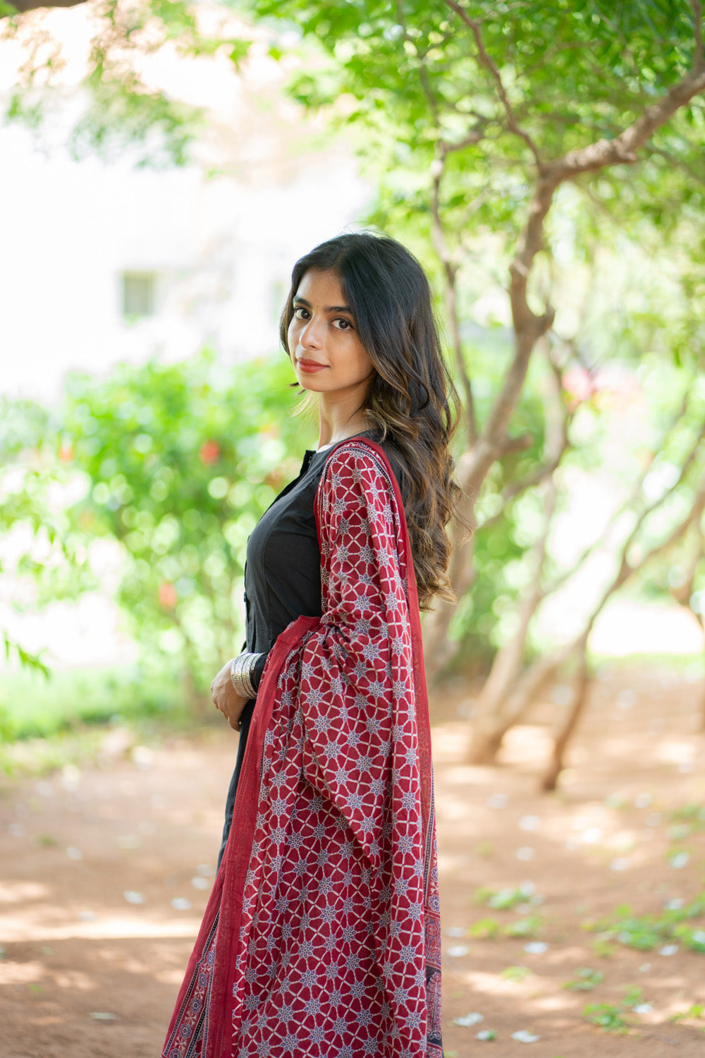 Shruti suit set - close view of red printed dupatta with geometric motifs
