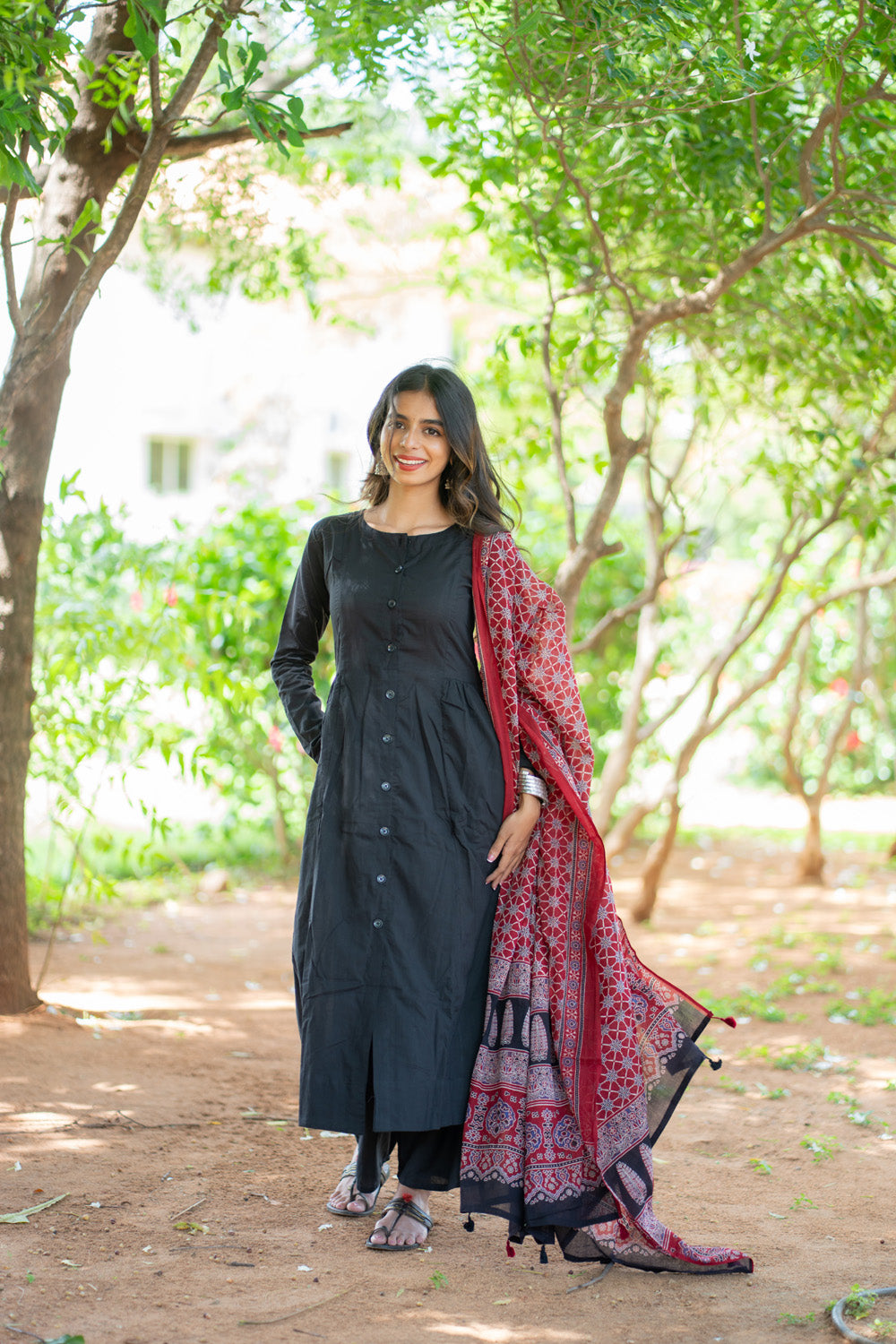 Shruti black button-front kurti with matching pant and red dupatta