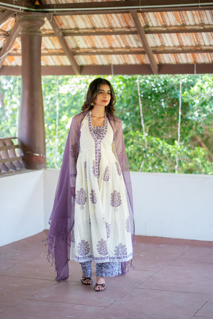 Suganya anarkali suit set with purple dupatta draped over both shoulders